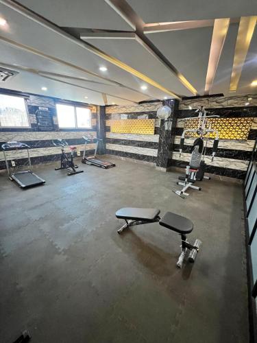 an empty gym with several treadms and machines in it at Citi Club in Kānpur