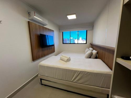 Ένα ή περισσότερα κρεβάτια σε δωμάτιο στο Studio Design 3 Apt 915 -Mandi Hospitalidade