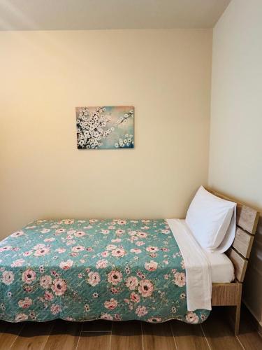 Ένα ή περισσότερα κρεβάτια σε δωμάτιο στο Secret Garden Guesthouse