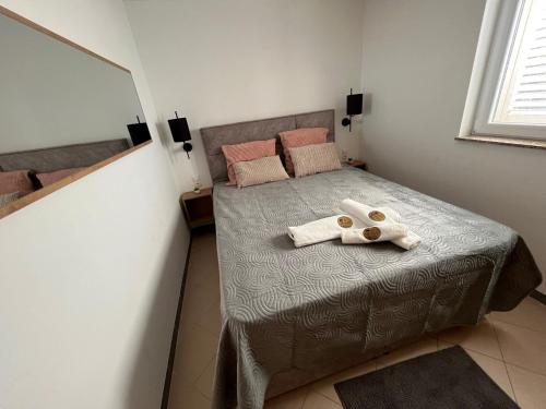 Postel nebo postele na pokoji v ubytování Beach Apartments