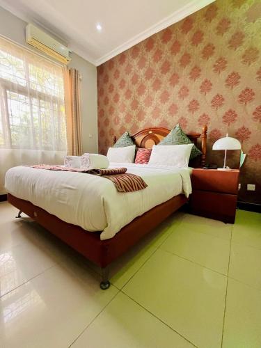 Katil atau katil-katil dalam bilik di Shavilla Hotel