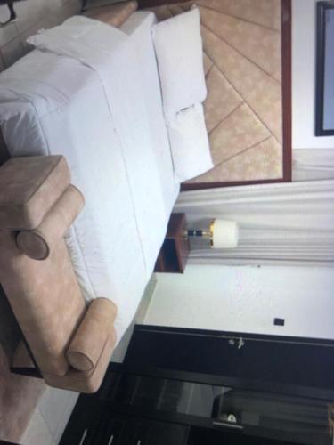 a hand holding a piece of paper in a room at DEJ APARTMENTs BY LAND MARK in Lekki