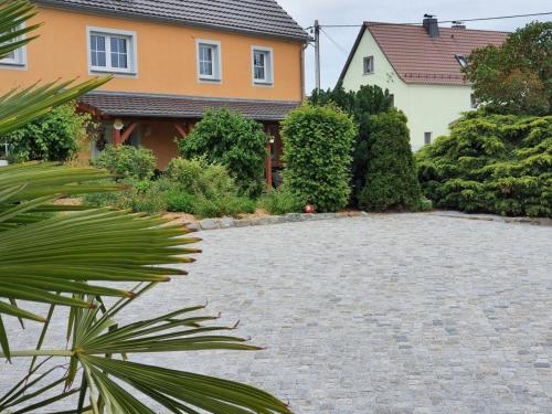 a stone driveway in front of a house at Landhaus Oberlausitz in Malschwitz