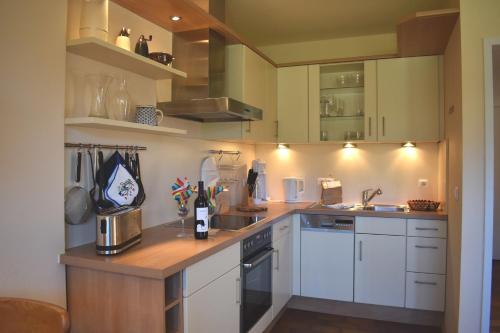 Kuchyň nebo kuchyňský kout v ubytování Resi K02