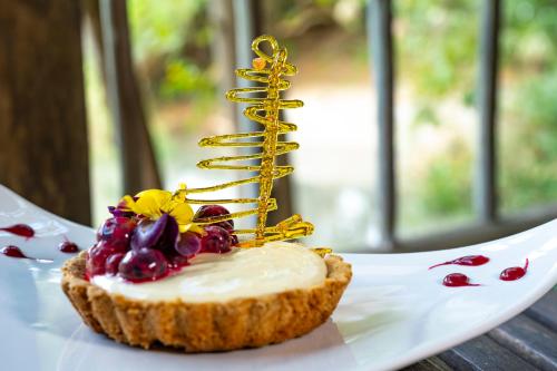 a piece of food on a white plate with a dessert at Woodall Country House and Spa in Addo