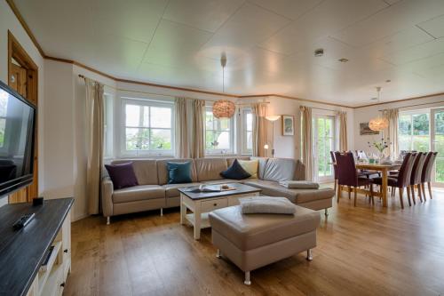 a living room with a couch and a table at Sandsturm in Prerow