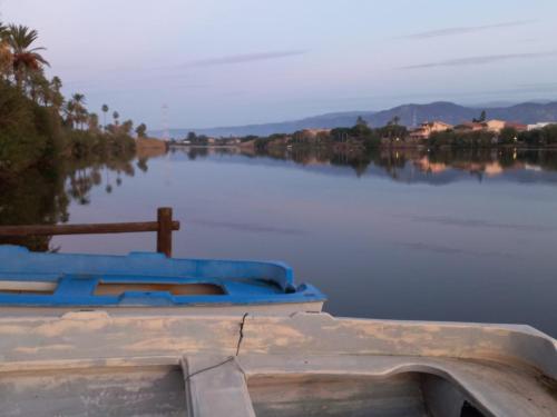 a boat is sitting on the water in a lake at Villa Fiori e Sapori in Messina