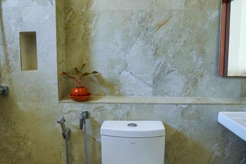 a bathroom with a white toilet and a sink at Rosemary Villa - Welegoda, Matara in Matara
