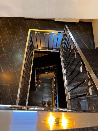 a spiral staircase in a building with a stair case at Hotel Marta in Oława