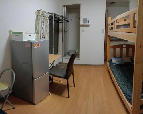 Palanda nebo palandy na pokoji v ubytování 新宿東京暖房