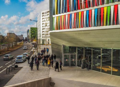 a group of people walking outside of a building at Auberge de Jeunesse HI Lille in Lille