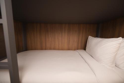 Кровать или кровати в номере W Airport Rooms Fortaleza