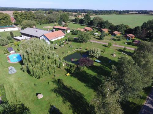 an aerial view of a park with a swimming pool at Landhof Kützin Ferienhaus 6 Specht in Wulfskuhl