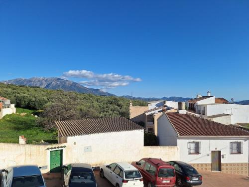a group of cars parked in a parking lot at Beautiful House in Periana, Ideal for hikers in Periana