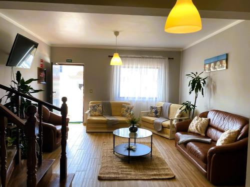 a living room with couches and a table at Ocean view - Baleal beach house - Surf & Relax in Baleal