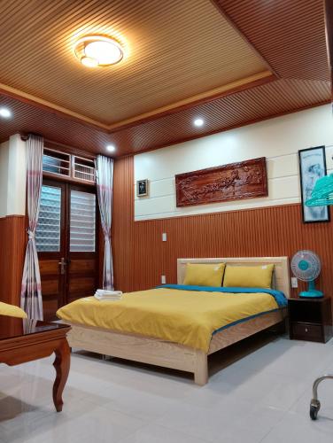 a bedroom with a large bed in a room at Q HOME Đà Lạt in Da Lat