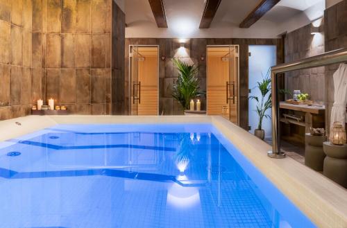 a large swimming pool in a room with a bathroom at Axel Hotel Valencia - Adults Only in Valencia
