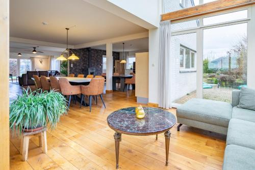 a living room with a couch and a table at Chill Nadrin in Houffalize