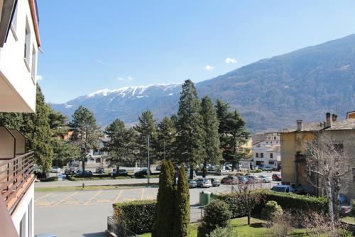 a view of a town with a snow covered mountain at Hotel La Rotonda in Tirano