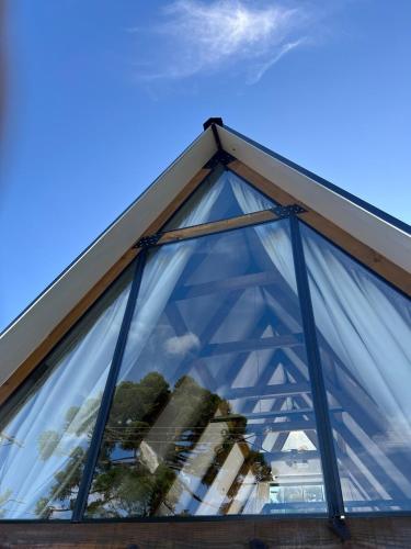a glass window on top of a building at Come live the Keike experience! in Canela