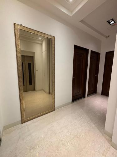 a mirror on a wall in a room at Ding Dong Homestay in Hengchun