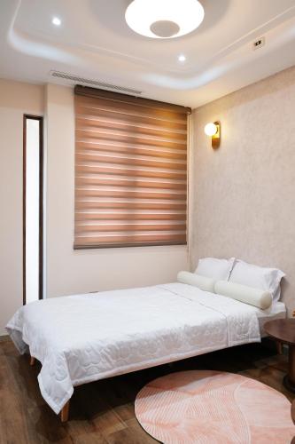 Postel nebo postele na pokoji v ubytování NAMstay Villa - Novaworld Phan Thiet