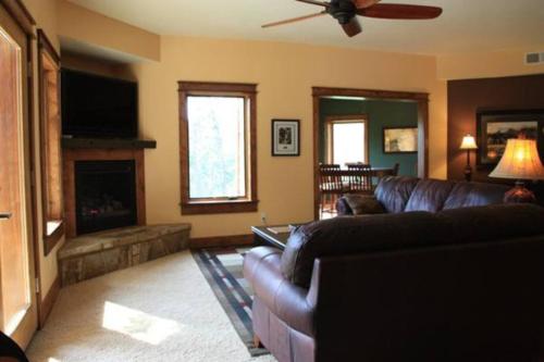 a living room with a couch and a fireplace at Cliff Davidson in Sampson