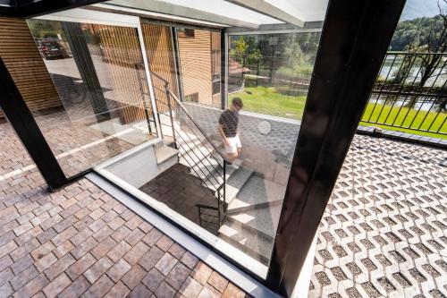 a person walking down the stairs of a house at Como home residence in Carlazzo