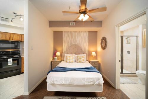 a bedroom with a bed and a ceiling fan at Cozy Enclave Bursting with Amenities in Lago Vista