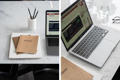 a laptop computer sitting on top of a table at Guestly Homes - Modern 4BR Villa with Sauna in Piteå