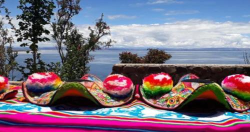 a pair of shoes sitting on top of a blanket at Inti Raymi Lodge in Escallani
