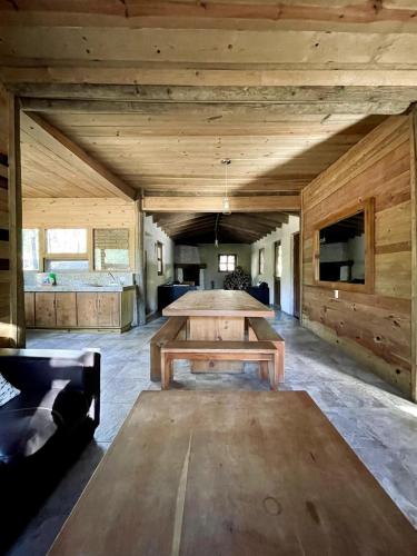 a large room with a table and a couch at Torre de Carpio, Cabaña Molitor in San Isidro