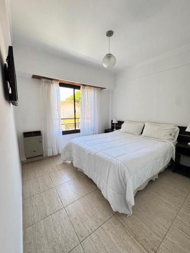 Postel nebo postele na pokoji v ubytování Montecarlo Hotel & Apart