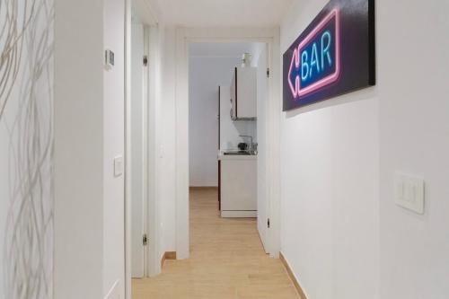 a hallway with a room with a sign on the wall at Residence i Tigli in Cinisello Balsamo