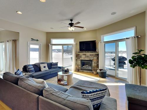a living room with a couch and a fireplace at Dacha Verde in Swanton