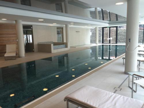 a large swimming pool in a large building at Zamek Topacz in Wrocław