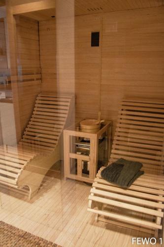 a room with two bunk beds and a table at Altstadthaus Neubert in Bodenwerder