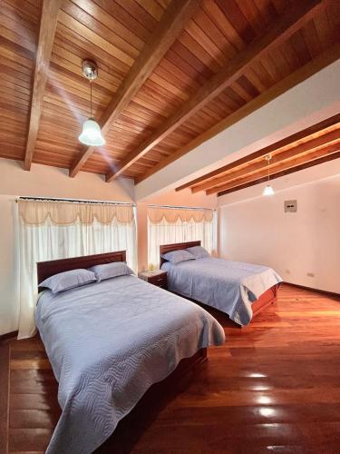 Postel nebo postele na pokoji v ubytování La Casa Ambateña