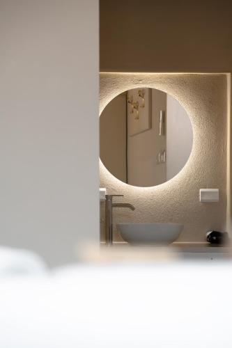 a bathroom with a sink and a mirror at FloVe' Rooms Venice in Venice