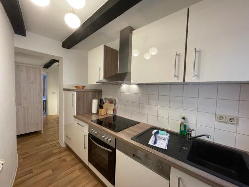 a kitchen with a sink and a stove at Apartment No10 in Quedlinburg