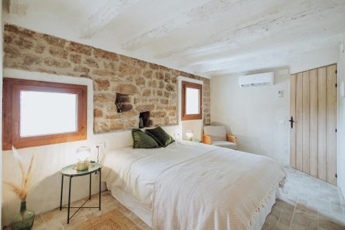 Postel nebo postele na pokoji v ubytování Masia Aubareda