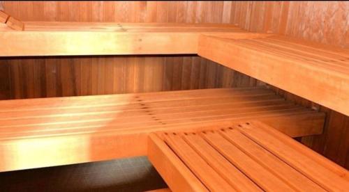 a wooden sauna with two wooden benches in it at Butjadinger Friesenstube in Butjadingen