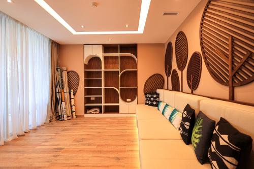 a wine cellar with a wall of wine bottles at SanPietro Premium Villas in Draçi