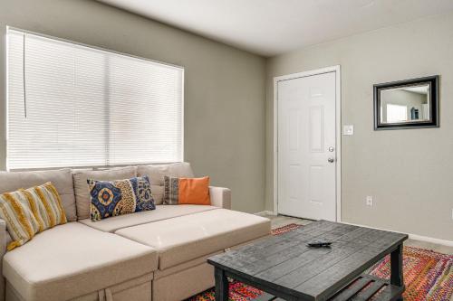 a living room with a couch and a table at 2 Mi to Dtwn and Chase Field Condo with City View! in Phoenix