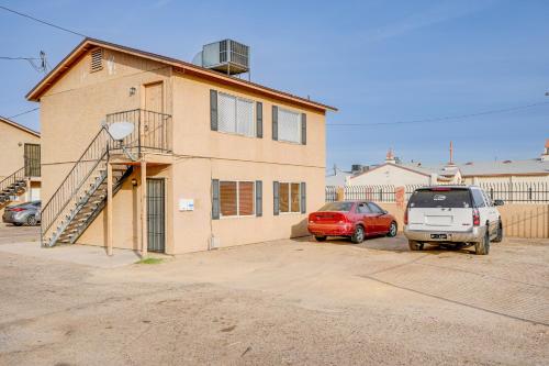 a house with two cars parked in a parking lot at 2 Mi to Dtwn and Chase Field Condo with City View! in Phoenix