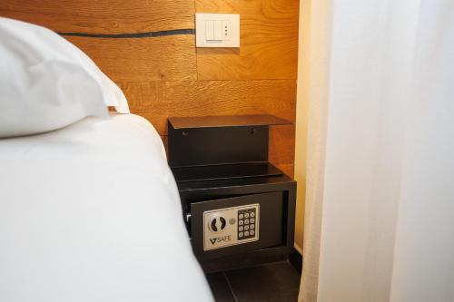 a bedroom with a bed and a tv in a room at 1823 Room in Chioggia