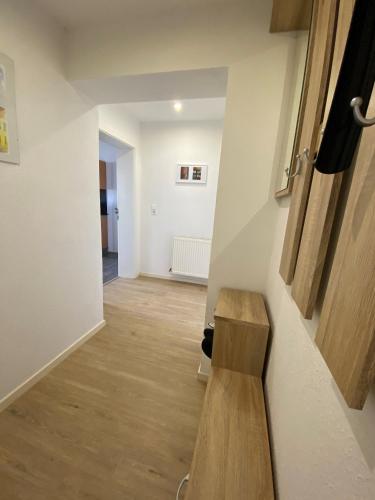a hallway with a wooden bench in a room at Alte Molkerei FeWo 1 in Zilly