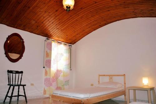 Ένα ή περισσότερα κρεβάτια σε δωμάτιο στο Al vicolo