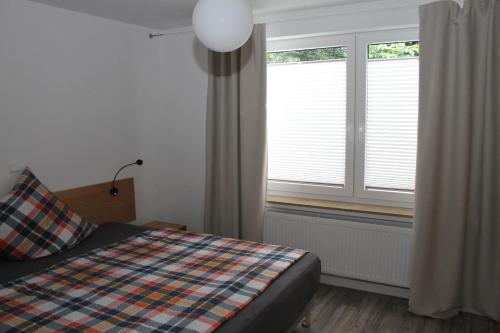 Postel nebo postele na pokoji v ubytování FeWo Oda