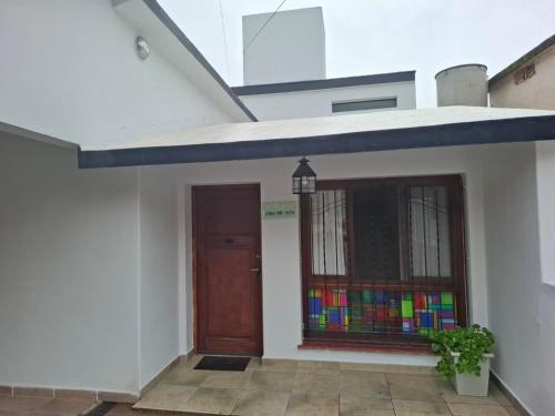 a house with a door and a stained glass window at Loma del Alto in Alta Gracia